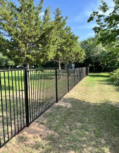 Metal Fence Running along property edge