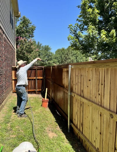 Contractor Spraying Deck