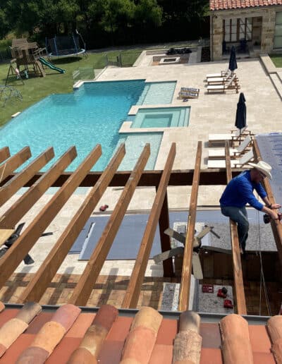 Contractors installing roof over new deck