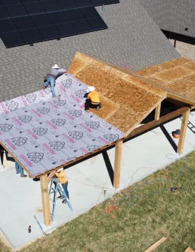 Skyview of deck with installation of roofing